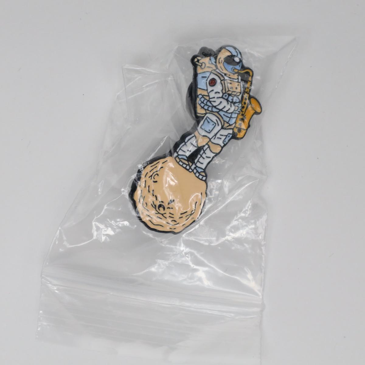 Astronaut Playing Sax Outer Space Enamel Pin