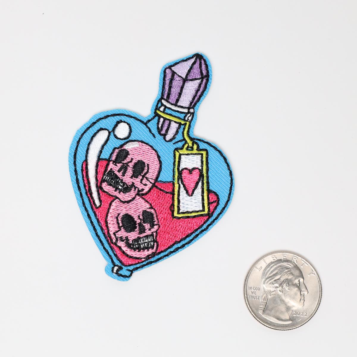 Poison Bottle with Skulls Iron On Embroidered Patch