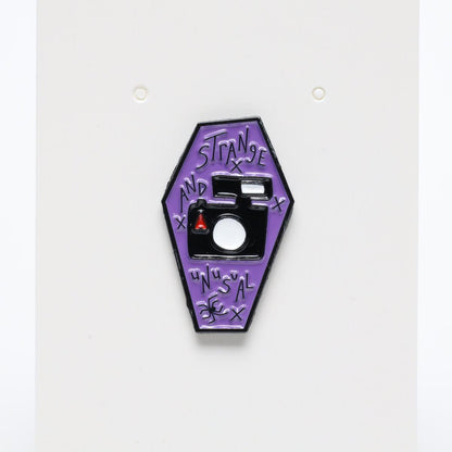 Strange & Unusual Linda’s Camera Beetlejuice Enamel Pin