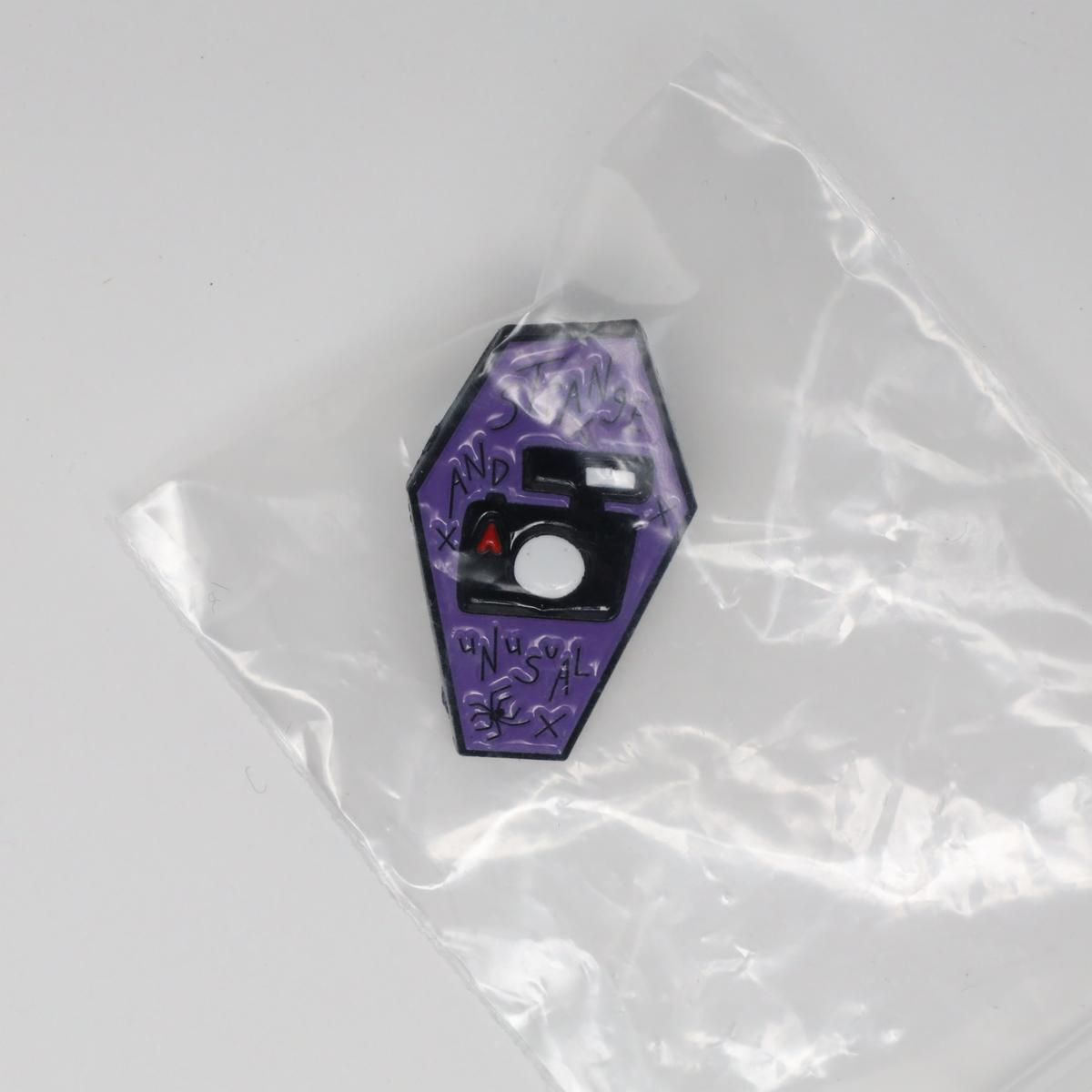 Strange & Unusual Linda’s Camera Beetlejuice Enamel Pin